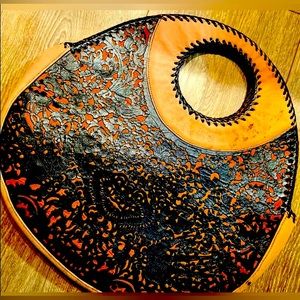 Handbag with filigree leather